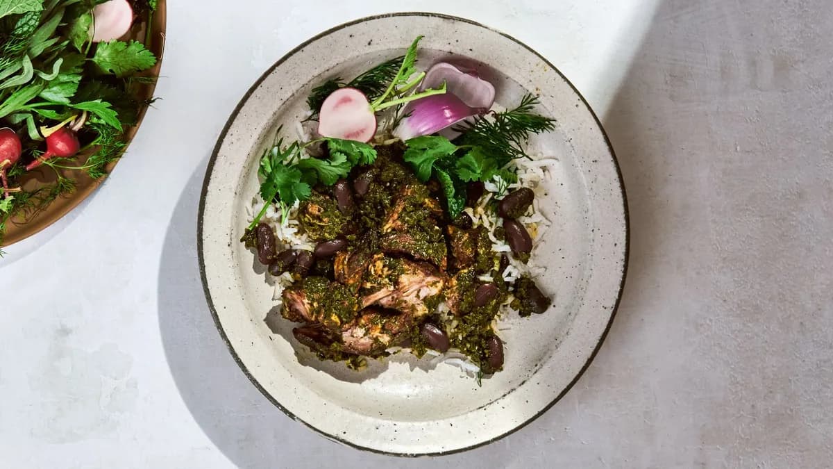 Ghormeh Sabzi Recipe Blog Feature Image Rich dark green ghormeh sabzi Persian herb stew in copper pot with dried limes and tender lamb at House of Legends Restaurant